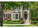Attractive home facade with a well-manicured lawn, mature trees, and a classic entrance; a picture-perfect residential home at 12350 Stevens Creek Dr, Alpharetta, GA 30005