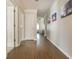 Long hallway with hardwood floors and neutral paint color at 12350 Stevens Creek Dr, Alpharetta, GA 30005