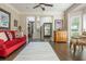 Open-concept living area featuring hardwood floors, neutral paint, and access to the foyer at 12350 Stevens Creek Dr, Alpharetta, GA 30005