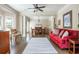 Open-concept living and dining rooms with hardwood floors and large windows at 12350 Stevens Creek Dr, Alpharetta, GA 30005