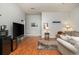 Cozy living room with hardwood floors, entertainment area, and comfortable seating; a welcoming space to relax and enjoy at 12350 Stevens Creek Dr, Alpharetta, GA 30005