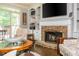 Beautiful living room with a stone fireplace and bright white shelving at 12350 Stevens Creek Dr, Alpharetta, GA 30005