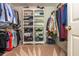 Organized walk-in closet with custom shelving and plenty of storage space at 12350 Stevens Creek Dr, Alpharetta, GA 30005