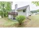 A large, grassy backyard featuring a well-maintained lawn and mature trees surrounding the property at 2682 Freemans Walk Path, Dacula, GA 30019