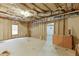Unfinished basement with exposed insulation, utilities, and a window, offering a blank canvas for customization at 2682 Freemans Walk Path, Dacula, GA 30019
