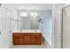 Bathroom with a double sink vanity, a large mirror, and a shower/tub combo at 2682 Freemans Walk Path, Dacula, GA 30019