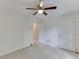 Bedroom with neutral carpet, closet, ceiling fan, and a view to a second bedroom at 2682 Freemans Walk Path, Dacula, GA 30019
