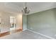 Dining room featuring neutral paint, carpet, and crown molding, providing a seamless transition to the adjacent kitchen at 2682 Freemans Walk Path, Dacula, GA 30019