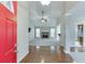 Inviting home foyer featuring hardwood floors, leading into a spacious living room with a stone fireplace at 2682 Freemans Walk Path, Dacula, GA 30019