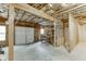 Unfinished garage with insulation, overhead door, and workbench, ready to be converted into a functional space at 2682 Freemans Walk Path, Dacula, GA 30019