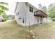 Home's exterior with a ground-level garage, basement access, and a small patio area at 2682 Freemans Walk Path, Dacula, GA 30019