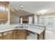 Bright kitchen offering generous counter space with a view into the living area and a door leading to the patio at 2682 Freemans Walk Path, Dacula, GA 30019