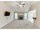 Living room with vaulted ceiling, fireplace, and view of kitchen and outdoor access at 2682 Freemans Walk Path, Dacula, GA 30019