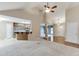 Open concept living room and kitchen with vaulted ceiling and hardwood entry at 2682 Freemans Walk Path, Dacula, GA 30019