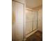 Bathroom featuring a glass shower door with neutral flooring and white walls at 3024 Orchard Ridge Cir, Duluth, GA 30096
