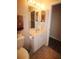 Bathroom featuring a toilet with accessibility bar and a sink vanity at 3024 Orchard Ridge Cir, Duluth, GA 30096