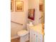 Bathroom featuring a toilet with accessibility bar and a sink vanity at 3024 Orchard Ridge Cir, Duluth, GA 30096