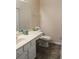 Well-lit bathroom featuring a single sink vanity and a toilet at 3024 Orchard Ridge Cir, Duluth, GA 30096