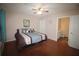 Comfortable bedroom with a king bed, ceiling fan and an ensuite bathroom for convenience at 3024 Orchard Ridge Cir, Duluth, GA 30096