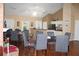Common area features tables, chairs, and a partial kitchen at 3024 Orchard Ridge Cir, Duluth, GA 30096