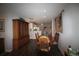 Inviting dining room leading to the kitchen area, featuring hardwood floors and ample lighting at 3024 Orchard Ridge Cir, Duluth, GA 30096