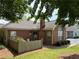 Cozy brick home featuring a quaint front porch and well-maintained landscaping at 3024 Orchard Ridge Cir, Duluth, GA 30096