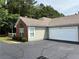 Well-kept house with an attached two-car garage and manicured shrubbery at 3024 Orchard Ridge Cir, Duluth, GA 30096