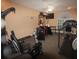Home gym with various exercise machines, weights, mirrored wall, and ceiling fan with recessed lighting at 3024 Orchard Ridge Cir, Duluth, GA 30096