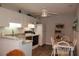 Well-lit kitchen with granite countertops and modern appliances, adjoined to an eat-in area at 3024 Orchard Ridge Cir, Duluth, GA 30096