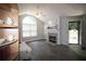 Bright living room featuring hardwood floors, fireplace, and arched window at 3024 Orchard Ridge Cir, Duluth, GA 30096