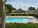 Inviting community pool area with lounge chairs and meticulously maintained landscaping at 3024 Orchard Ridge Cir, Duluth, GA 30096