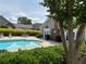 Refreshing community pool with lounge seating and lush greenery at 3024 Orchard Ridge Cir, Duluth, GA 30096