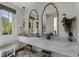 Modern bathroom with marble countertops, elegant mirrors, and stylish fixtures at 3888 Peachtree Dunwoody Rd, Atlanta, GA 30342