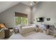 Bedroom featuring a daybed, glider, large window, and a clothes rack at 3888 Peachtree Dunwoody Rd, Atlanta, GA 30342