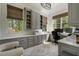 Bright office with custom built-ins, large windows, and desk space at 3888 Peachtree Dunwoody Rd, Atlanta, GA 30342