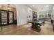 Large rec room features a ping pong table, wine storage, and views of the backyard at 3888 Peachtree Dunwoody Rd, Atlanta, GA 30342