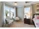 Inviting bedroom featuring plush carpet, neutral tones, and ample natural light at 655 Grove Manor Ct, Suwanee, GA 30024