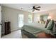 Bedroom with a door to the outside, plus a dresser and mirror; great natural light at 655 Grove Manor Ct, Suwanee, GA 30024