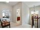 Upstairs hallway provides access to bedrooms and bathrooms with a view of the main bedroom at 655 Grove Manor Ct, Suwanee, GA 30024