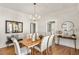 Stylish dining room with hardwood floors, modern chandelier, and natural light at 1050 Lawton Sw Ave, Atlanta, GA 30310