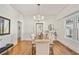 Elegant dining room with hardwood floors, modern chandelier, and natural light at 1050 Lawton Sw Ave, Atlanta, GA 30310