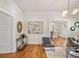 Bright living room featuring hardwood floors, modern light fixtures, and neutral paint at 1050 Lawton Sw Ave, Atlanta, GA 30310
