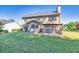 Large backyard featuring a patio with gazebo and lush green lawn at 1500 Highland Farm Dr, Suwanee, GA 30024
