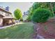 Large backyard featuring a patio with gazebo and lush green lawn at 1500 Highland Farm Dr, Suwanee, GA 30024