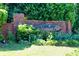 Highland Lake neighborhood sign, with a brick base, surrounded by lush greenery at 1500 Highland Farm Dr, Suwanee, GA 30024