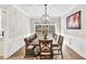 Dining room with window view and decorative lighting at 1500 Highland Farm Dr, Suwanee, GA 30024