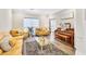 Cozy living room with hardwood floors, ample lighting, and comfortable seating arrangements at 1500 Highland Farm Dr, Suwanee, GA 30024