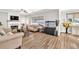 Open-concept living room with fireplace, hardwood flooring, and bright, neutral decor at 1500 Highland Farm Dr, Suwanee, GA 30024