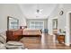 Spacious bedroom with tray ceilings and hardwood flooring at 1500 Highland Farm Dr, Suwanee, GA 30024