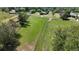 Expansive aerial view of a lush, green acreage property with mature trees and fenced perimeters, showcasing its natural beauty at 200 Mcclure Dr, Cumming, GA 30028